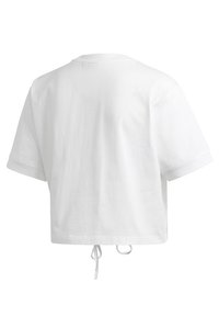 Vit kortärmad avkortad t-shirt sedd bakifrån med rund hals och två hängande tygband i nederkanten.