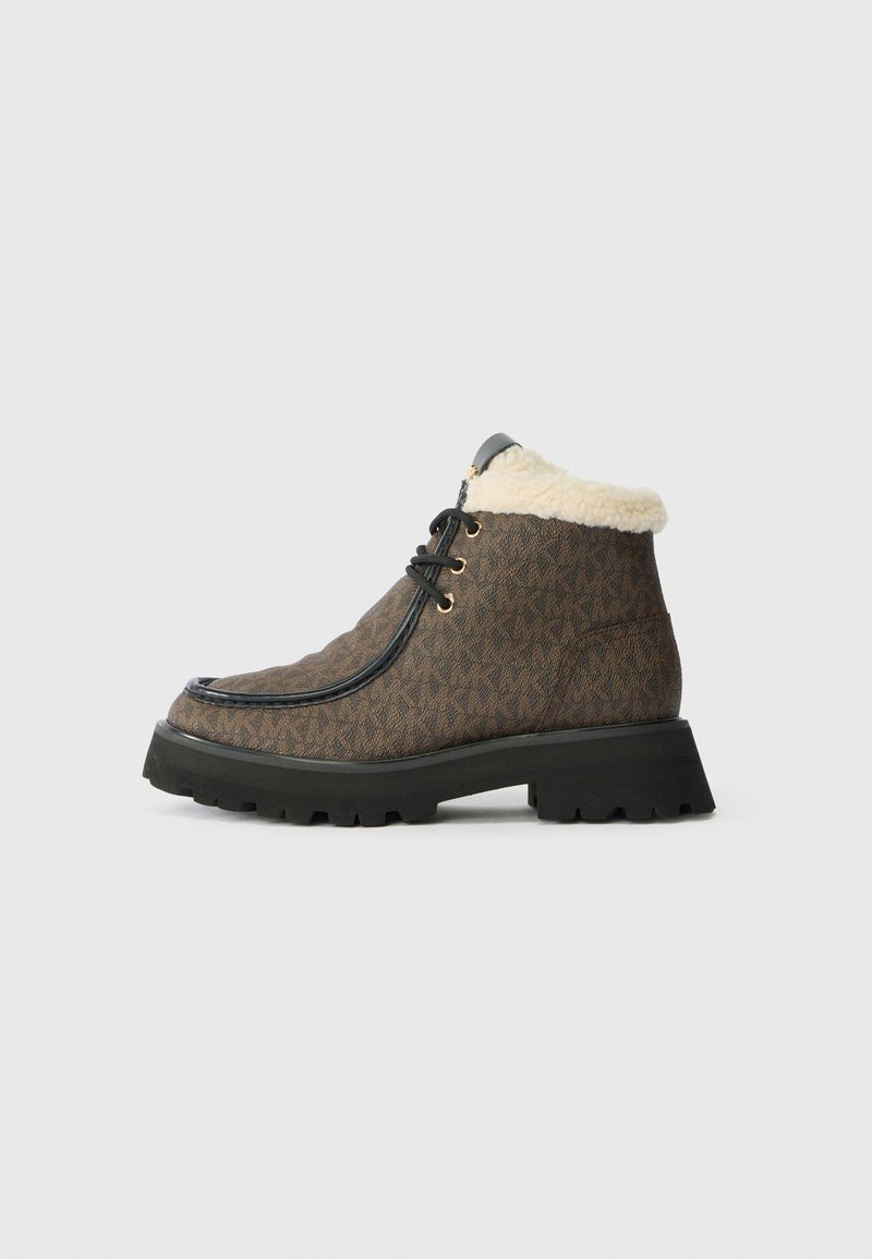 Brown patterned ankle boot with black sole, black laces, and cream fleece lining collar on a white background.
