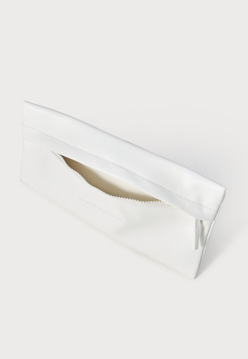 White zippered pouch made of smooth material, featuring a rounded top and visible stitching details, with an open compartment revealing a light interior.