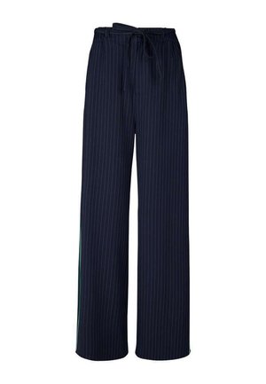 Pantalon large bleu marine à fines rayures blanches, taille élastique et ceinture en tissu nouée.