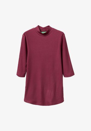 Túnica de color burdeos de canalé con un cuello alto, mangas tres cuartos y un corte relajado. La textura suave y el tejido liso aumentan la comodidad.