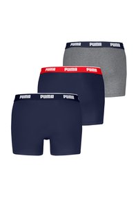 Tres pares de calzoncillos ajustados en azul marino, gris y negro, con cinturillas elásticas de marca en colores contrastantes.