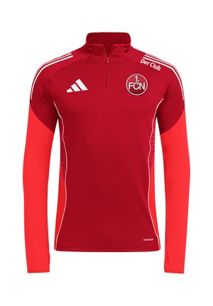 Rød langærmet sportstræningstrøje med kvart lynlås, hvidt adidas-logo, 1. FCN klubmærke og hvide striber på skuldrene.