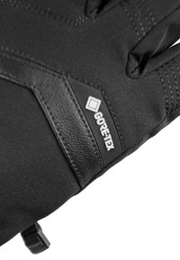 Black gloves featuring a textured leather patch and a Gore-Tex logo. The material is smooth with stitching details along the seams.