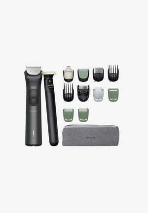 Philips Pflege-Kit mit zwei Trimmern: dunkelgrau und schwarz, mehreren Aufsteckkämmen in grün und schwarz sowie einem grauen Aufbewahrungstasche.