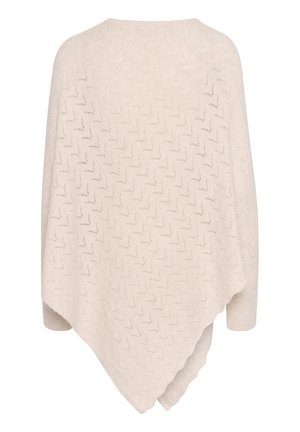 Poncho en laine crème avec motif ajouré en zigzag et poignets côtelés, présentant un ourlet asymétrique.