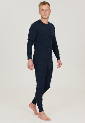Marineblauwe thermoset gemaakt van zachte, gestructureerde stof. Langemanige top met ronde hals, gecombineerd met aansluitende lange broek.