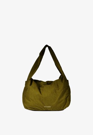 Sac d'épaule en tissu vert olive avec une large bandoulière et un petit logo blanc "Craie Studio" à l'avant.