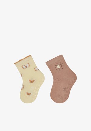 Zwei Paar Socken: eines gelb mit Schmetterlingsmustern und einem Rüschensaum; das andere braun mit einem Sonnendesign. Beide sind aus weichem Stoff gefertigt.