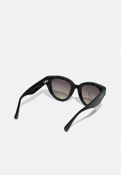 Black cat-eye sunglasses with gradient lenses. Plastic frame, sleek design, and gold hardware detail on the temple.