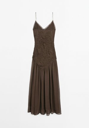 Brown dress with adjustable thin straps, intricate textured bodice, and flowy skirt. Made from lightweight fabric with a soft drape.