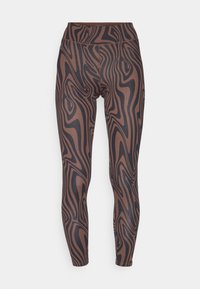 Leggings brun et noir avec un motif, dotés d'une taille haute et d'un tissu lisse et extensible avec un design ondulé sur l'ensemble.