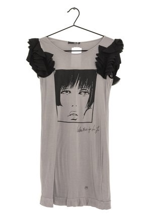 Gray short-sleeve dress with black ruffled shoulder accents and a black-and-white graphic of a woman's face on the front, hanging on a hanger.