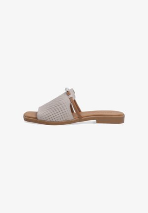 Beige perforated leather slide sandal with a brown accent strap and silver hardware. Flat sole with rounded toe and minimalistic design.