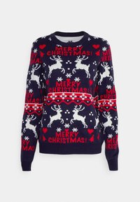 Marinblå stickad tröja med vita renar, röda hjärtan och snöflingor, samt fet text "GOD JUL!" i rött. Rund hals och ribbade ärmavslut.