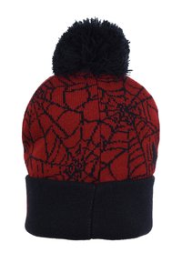Red knit beanie with a black spiderweb pattern, featuring a black pom-pom on top and a solid black cuff at the bottom.