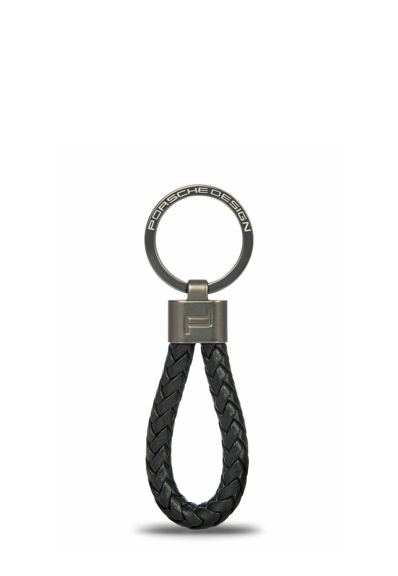 Keyring with braided black leather loop, metal top piece engraved with "Porsche Design," and circular metal ring with engraved logo.