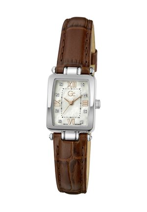 Ruutujas hõbedane käekell pruunist nahkrihmaga, valge sihverplaadiga, rooma numbritega 12, 3, 6, 9 kohal ja kristallist tunniindeksitega, näidates kella 10:08:20.