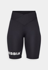 Crne biciklističke šortse s visokim, ukriženim pojasom. Izrađene od rastezljivog materijala s bijelim "DEBBIA" brendiranjem na lijevoj nozi. Glatka tekstura.