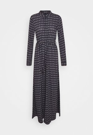 Pitkähihainen, napitettava maksimekko, jossa tummanvärinen geometrinen kuvio ja siihen sopiva kangasvyö vyötäröllä.