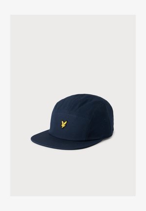 Marineblauwe vijfpaneelpet met vlakke klep en klein geel geborduurd vogel-logo in het midden van het voorpaneel.