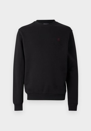 Mustast puuvillast dressipluus ümara kaelusega, soonikkoes varrukakätiste ja alläärega. Esiküljel väike punane logoga. Siidine tekstuur, minimalistlik disain.