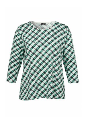 Haut à manches longues avec un motif à carreaux diagonaux vert, noir et blanc et un col rond.