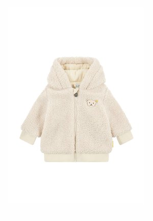 Chaqueta de forro polar con capucha para niño pequeño de color crema, con cremallera y pequeño bordado de cara de oso en el pecho.