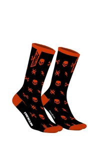 Chaussettes noires avec des motifs de crânes orange et d'éclairs ; bord côtelé ; marquées "FREEGUN" sur le côté ; texture de tissu douce.