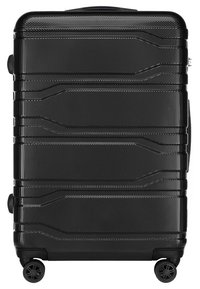 Valise noire à coque rigide avec surface texturée, lignes verticales, double roulettes et poignée rétractable. Elle dispose d'une fermeture éclair sécurisée.