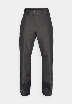 Pantalones de nieve negros con una textura suave, cintura alta, dos bolsillos y paneles oscuros contrastantes en las piernas inferiores. Cerrados con dos botones.