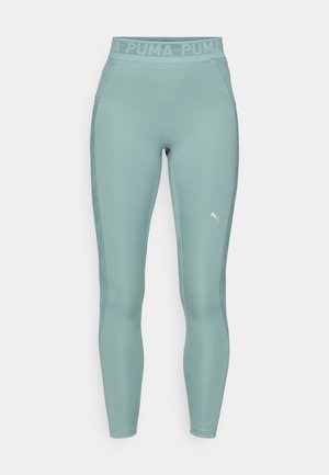 Svijetlozeleni Puma tajice s visokim strukom na kojem se nalazi tekst logotipa, glatke teksture i prilagođenog dizajna, prikladne za sportske aktivnosti.