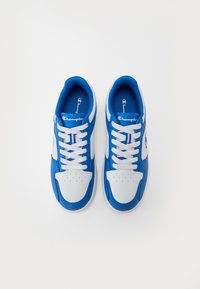 Blue and white sneakers featuring a smooth leather upper, perforated toe, white laces, and a padded collar for comfort.