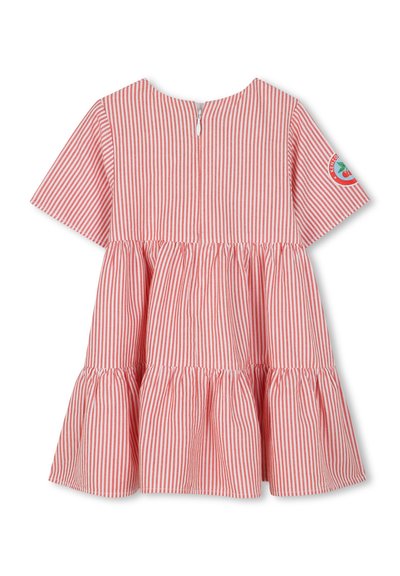 Robe rayée rouge et blanche avec des manches courtes, jupe à volants et fermeture éclair au dos. Dotée d'un col rond et d'un écusson sur la manche.