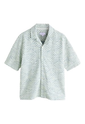 Chemise à manches courtes boutonnée vert clair avec un motif abstrait ondulé et un col décontracté, taille moyenne.