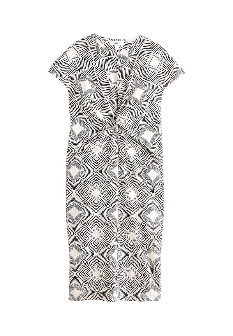 Zwart-witte jurk met patroon en korte mouwen, met een gedraaide voorkant en geometrische vormen over de hele stof.