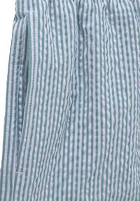 Groen en wit gestreepte stof met een gestructureerde uitstraling. Kenmerkt zich door een gegatherede taille met lichte elasticiteit en zijzakdetail.