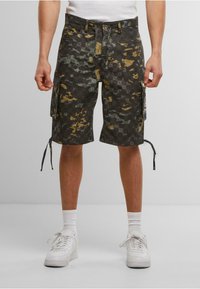 Cargo shorts in a black, green, and yellow camouflage pattern; featuring pockets, drawstrings at the hem, and a relaxed fit.