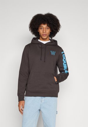 Dark brown hoodie with kangaroo pocket; features blue logo on chest and vertical text on sleeve; cotton blend fabric with smooth texture.