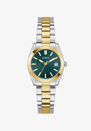 Guess watch with a round dark green face, gold bezel, silver and gold stainless steel bracelet, date display, and minimalist hour markers.