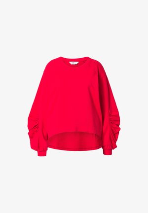 Červená mikina s dlouhým rukávem a kulatým výstřihem, s nařasenými detaily na rukávech a zkráceným spodním lemem. Vyrobena z měkké bavlny.