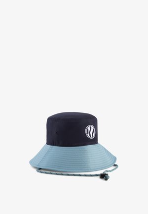 Navy and light blue bucket hat with wide brim, embroidered logo, ventilation eyelets, and an adjustable chin cord with toggle.