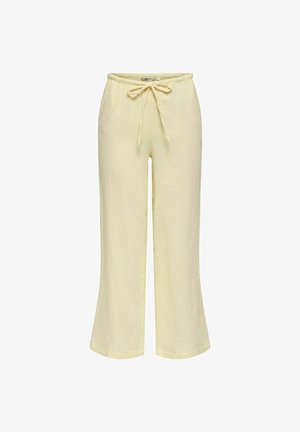 Lysegule løstsiddende bukser med elastisk linning og bundet snor foran, lavet af tekstureret stof.