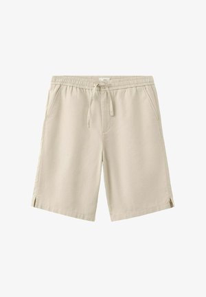 Pantaloncini beige al ginocchio con elastico in vita, coulisse, due tasche laterali e piccoli spacchi laterali all'orlo di entrambe le gambe.