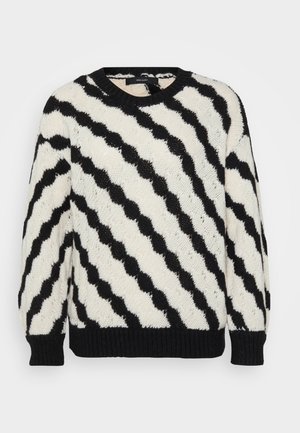 Maglione in bianco e nero con un motivo a strisce ondulate. Realizzato in tessuto texturizzato, con collo rotondo e polsini e orlo a costine.