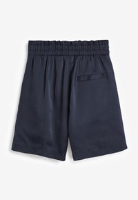 Navy blue shorts made of smooth fabric, featuring an elastic waistband, pleats, and a single back pocket. Simple, classic design.