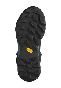 Semelle Vibram avec des crampons profonds pour une adhérence, en matériau caoutchouteux noir avec un détail de logo jaune. Surface robuste et texturée.