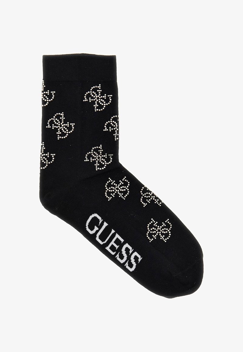 Sort bomuldsstrømpe med rhinestone-logo mønster og hvid "GUESS" tekst på sålen. Velegnet til afslappet brug.