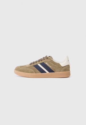 Olive suede sneaker with navy and white stripes, beige rubber sole, round toe, and lace-up front. Brand name "BALLY" on the side.