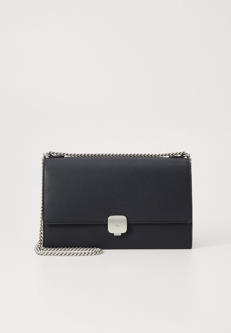 Black leather clutch with a textured surface, silver clasp, and a chain strap. Rectangular shape with minimalistic design.